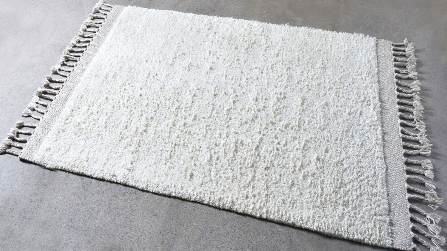 Tapis en laine tissé artisalement bouclé beige 120 x 180 cm - Wigan Tapis en laine tissé artisalement bouclé beige 120 x 180 cm - Wigan