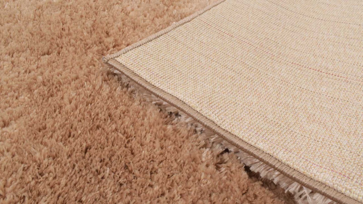 Tapis à poils longs uni beige 67x90 cm - Oslo